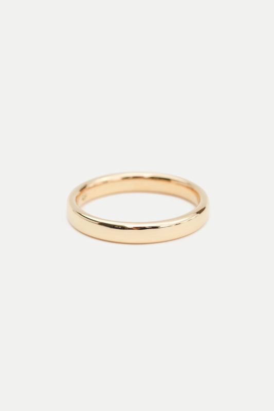A simple 3mm gold band ring displayed on a white background.
